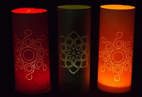 3 paper lanterns lit up