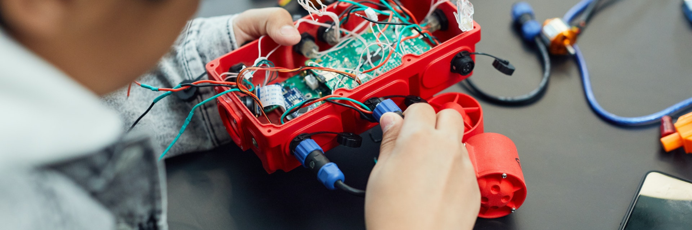 Child working on a robotics project