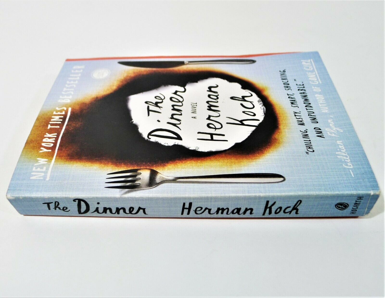 Cover of Herman Koch's The Dinner book as seen from an angle.
