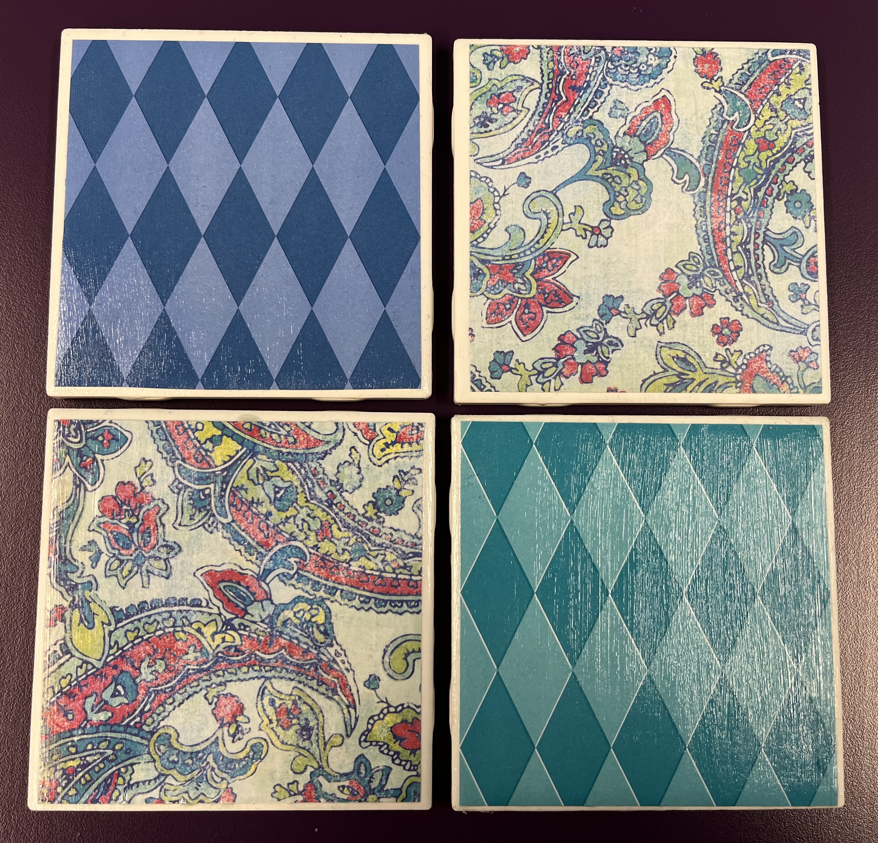 4 coasters covered with scrapbook paper