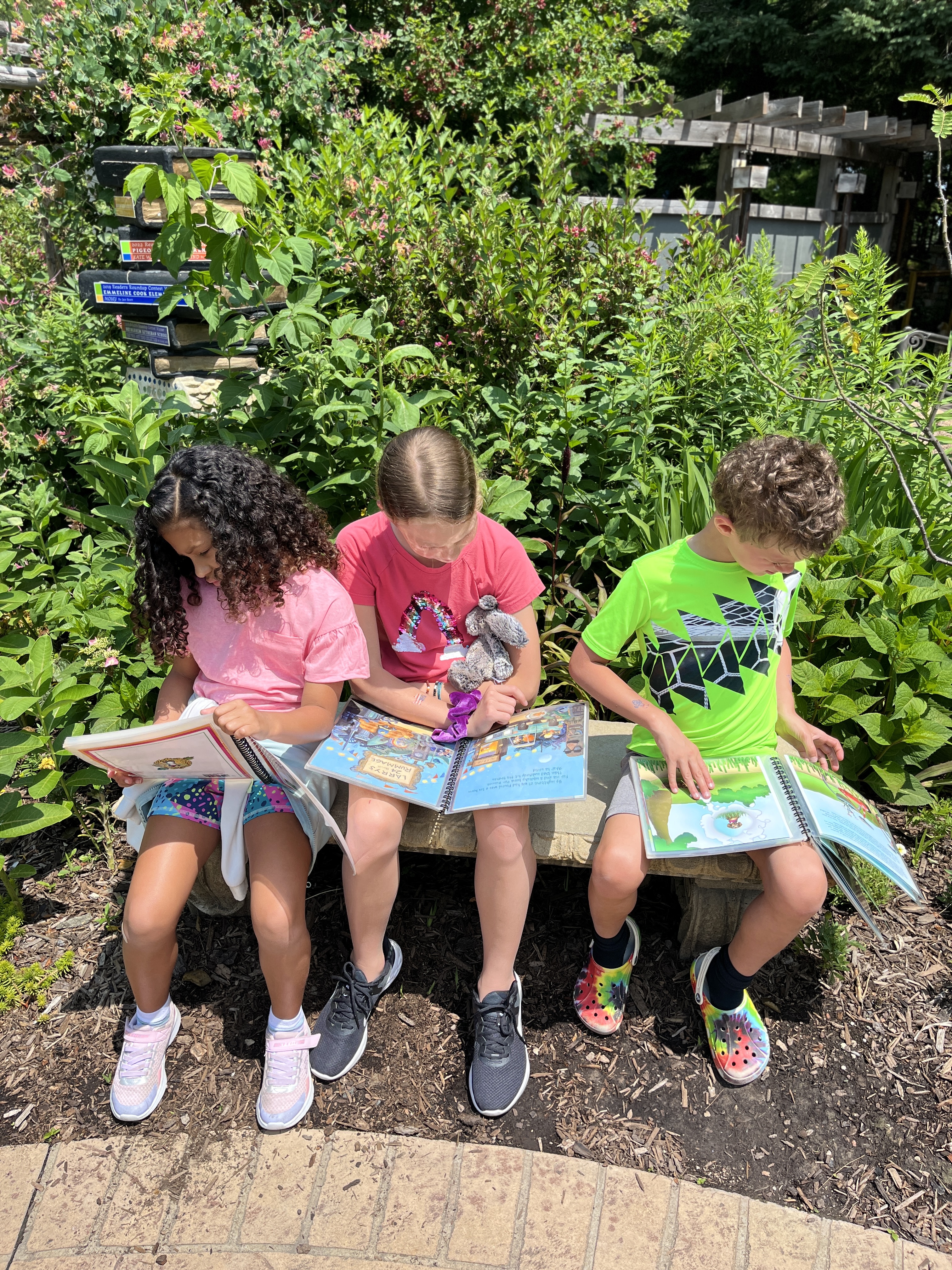 Children reading at Bookworm Gardens.