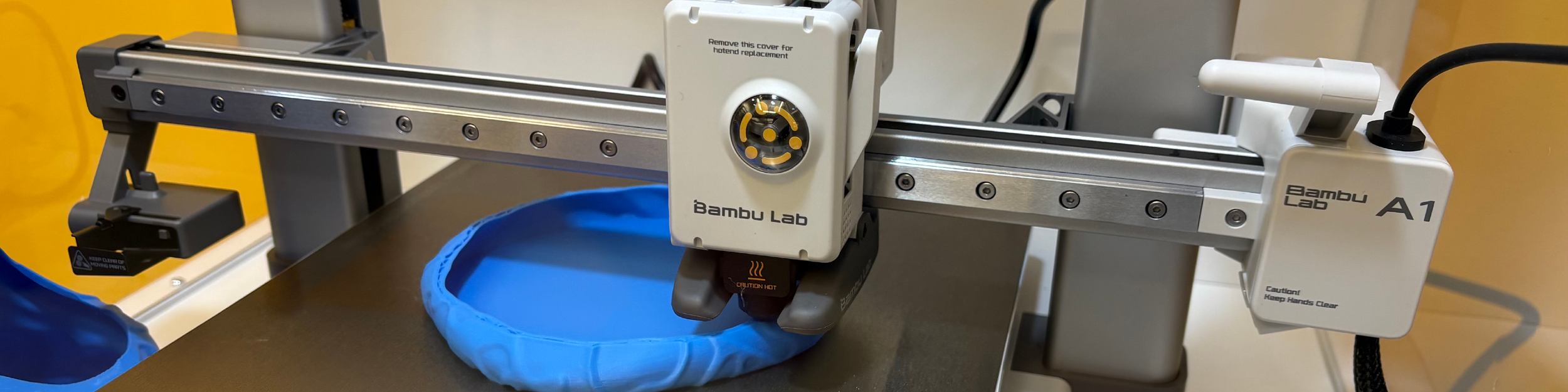 A closeup of the Bambu Lab A1 3D printer in the Children's Library