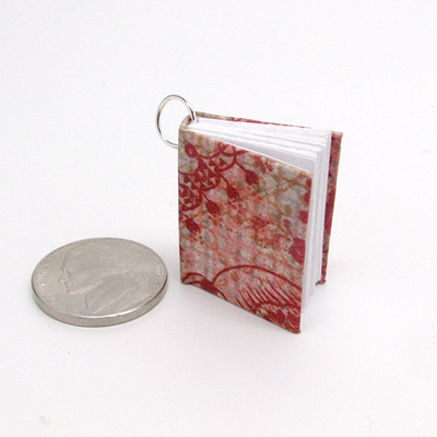 Photo of mini book pendant from ILovePaperBeads