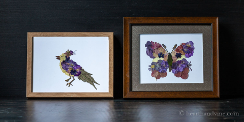 Pressed flower art of a bird and butterfly