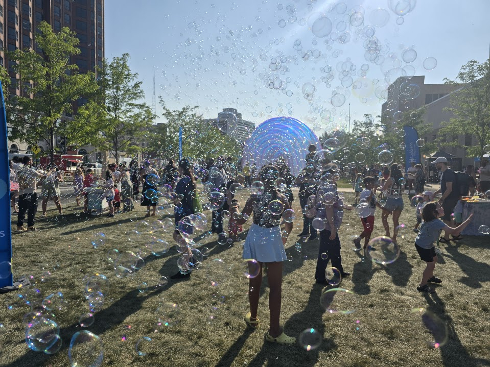A large group of people surrounded by bubbles